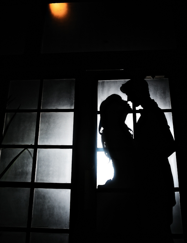  black and white - silhouette of couple in a frosted multi-pannel window -photo by New York City based wedding photographer Ryan Brenizer 